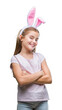 © Krakenimages.com - Young beautiful girl wearing easter bunny ears over isolated background happy face smiling with crossed arms looking at the camera. Positive person.