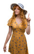 © Krakenimages.com - Young redhead woman wearing summer hat and dress surprised with an idea or question pointing finger with happy face, number one
