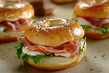 Wall Mural - Tasty breakfast burger featuring prosciutto cream cheese and lettuce along with a ham bagel in close up view