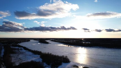 Wall Mural - a peaceful winter river scene showing the river daugava with ice and sunset light