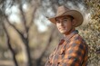 © LimeSky - Male figure in a cowboy outfit reflecting western ranch culture in Texas featuring a hat and flannel style amidst nature and greenery