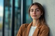 © Fightstar - Female architect leaning against contemporary office structure