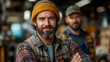 © Collorio - Craftsman smiling confidently in workshop environment, artisan portrait