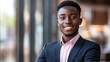 © InspirationDesign - Confident young professional in business attire smiling. Perfect for corporate success and diversity representation