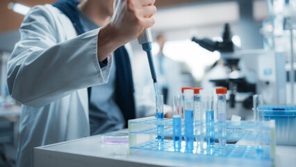 Leinwandbilder - Medical Research Laboratory: Scientist Using Micropipette to Analyze Samples Under Microscope. Advanced Scientific Lab for Medicine, Biotechnology, Microbiology Development