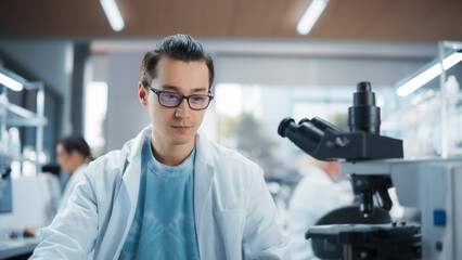 Aufkleber - Genetic Research and Development Laboratory: Portrait of a Young Science Student Working and Looking at a Sample Under a Microscope. Advanced Biotechnology Lab with Modern Equipment