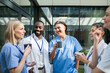 © Marko Geber - Healthcare professionals enjoying coffee break outside hospital