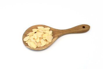 Wall Mural - almond flakes in a wooden spoon isolated on white