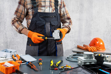 Wall Mural -  electrician working on the electrical system. repairing electrical equipment.