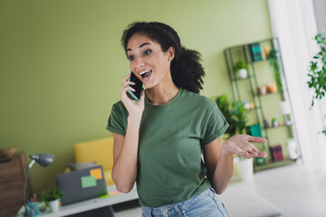 Wall Mural - Photo of lovely young girl chatting talk phone dressed green garment house home indoors room