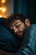 © StockUp - A serene young man sleeps soundly under soft lights, embodying peace and tranquility in the night's embrace.