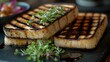 © Ainul - Close-up of Grilled Halloumi Cheese Slices on a Dark Plate, Garnished with Fresh Herbs