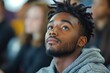 © Vision Studio - Black male student paying attention during class at university. Generative AI