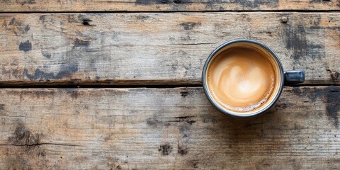 Wall Mural - Coffee cup seen from above on aged wooden surface, showcasing the coffee cup s design against the rustic texture of the old wooden background, perfect for coffee themed compositions.