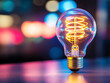 © Vasili - A glowing lightbulb against a blurred vibrant background. The concept of innovation and bright ideas, ideal for business, creativity, and inspiration themes.