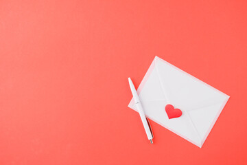 Wall Mural - valentines day letter and envelope on red background