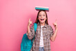 © deagreez - Portrait of a cheerful schoolgirl with books and backpack on pink background