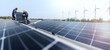 © ultramansk - Male workers repair Floating solar panels on water lake. Engineers construct on site Floating solar panels at sun light. clean energy for future living. with wind turbine farm for renewable energy.