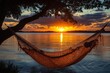 © Aurora Blaze - Hammock at sunset by the lake for relaxation and tranquility in nature