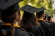 © cff999 - graduates in caps and gowns are standing in a row
