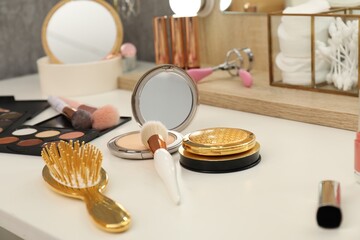 Wall Mural - Makeup room. Different beauty products on white dressing table, closeup