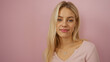 © Krakenimages.com - Woman smiling over a pink background, featuring an attractive blonde adult with a beautiful, serene expression, highlighting her youthful caucasian appearance and isolated setting.
