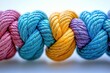 © furyon - multicolored braided rope network symbolizing unity and diversity in teamwork with connected strands against clean white background