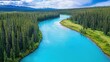 © Fenny - Aerial view of a turquoise river winding through a lush green forest. (2)