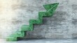© thenort - Green marble staircase ascending as an arrow against a concrete wall, symbolizing growth and progress.