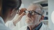 © Pixcellence - Eye Exam: Optometrist Checks Senior's Vision