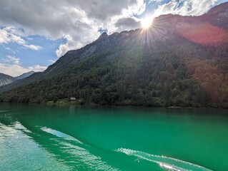 Sunshine and beautiful emerald green water at the Königssee in Berchtesgaden, Bavaria (Germany)