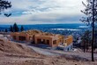 © Виталий Борковский - New homes rise majestically on a hillside overlooking the valley below