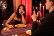 © Home-stock - Boring date. Man using smartphone in restaurant and ignoring his girlfriend during romantic dinner, sitting at table