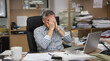 © Pavel - An Overwhelmed Office Worker Stressed Out by Excessive Paperwork and Intense Deadline Pressure