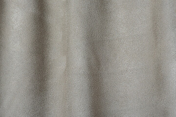Wall Mural - gray-beige suede in a fold as a background.