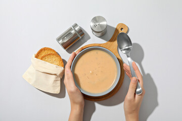 Wall Mural - A bowl of cream of mushroom soup with croutons