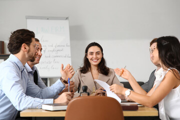 Wall Mural - Group of lawyers working at table in office