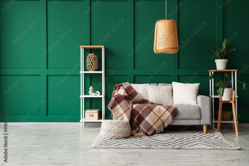Interior of living room with sofa and knitted blanket