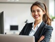 © Chalermrach - Front view portrait of smiling adult woman at home office workplace looking at camera with confidence and professional demeanor, technology, office setting