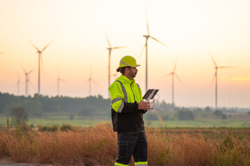 Wall Mural - engineer specialists pilot drone on wind turbine farm. architectural engineer and safety engineering