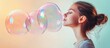 © The 2R Artificiality - Young woman blowing large colorful soap bubbles with soft pastel background and ample empty space for text on the right side.