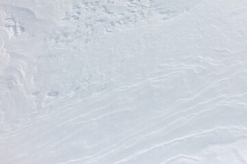 Wall Mural - A snow covered ground with a few footprints