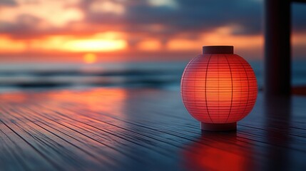 Wall Mural - Glowing paper lantern on wooden deck at sunset.