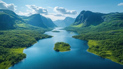 Wall Mural - Aerial view of a serene lake nestled between lush green mountains under a bright sky.