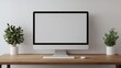 © oksa_studio - Modern minimalist office with computer showing blank screen, perfect for showcasing your design