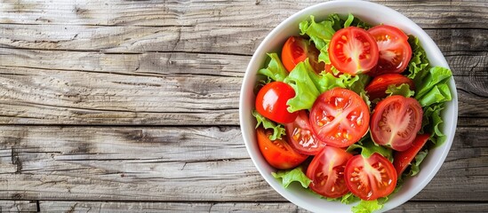 Poster - Close up of a healthy salad featuring tomatoes in a vintage bowl on a rustic wooden surface Top view copy space