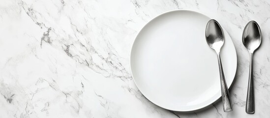 Aufkleber - Image of an empty white plate with a spoon and fork set against a white marble background Selective focus with a blurred background. with copy space image. Place for adding text or design