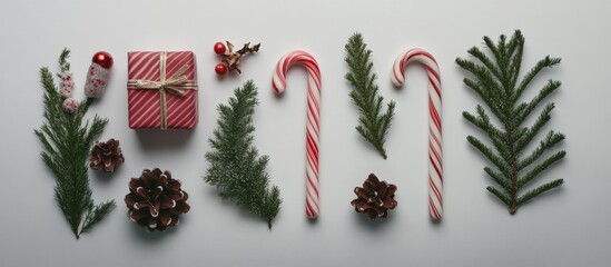Aufkleber - Flat lay arrangement of Christmas items including candy canes pine and a gift. with copy space image. Place for adding text or design