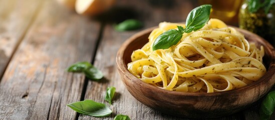 Fototapete - Pasta with Pesto Genovese on a wooden surface. with copy space image. Place for adding text or design