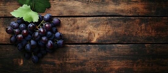 Aufkleber - Bunch of grapes on a rustic wooden surface Top view. with copy space image. Place for adding text or design